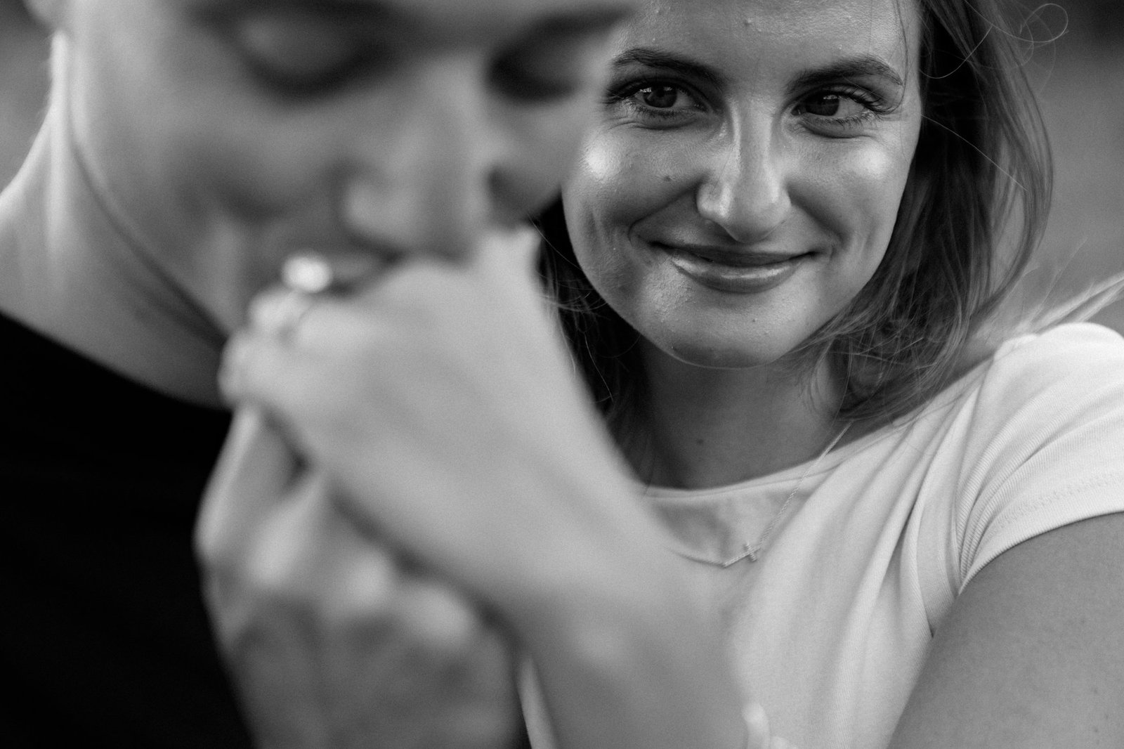 A black-and-white close portrait of a couple