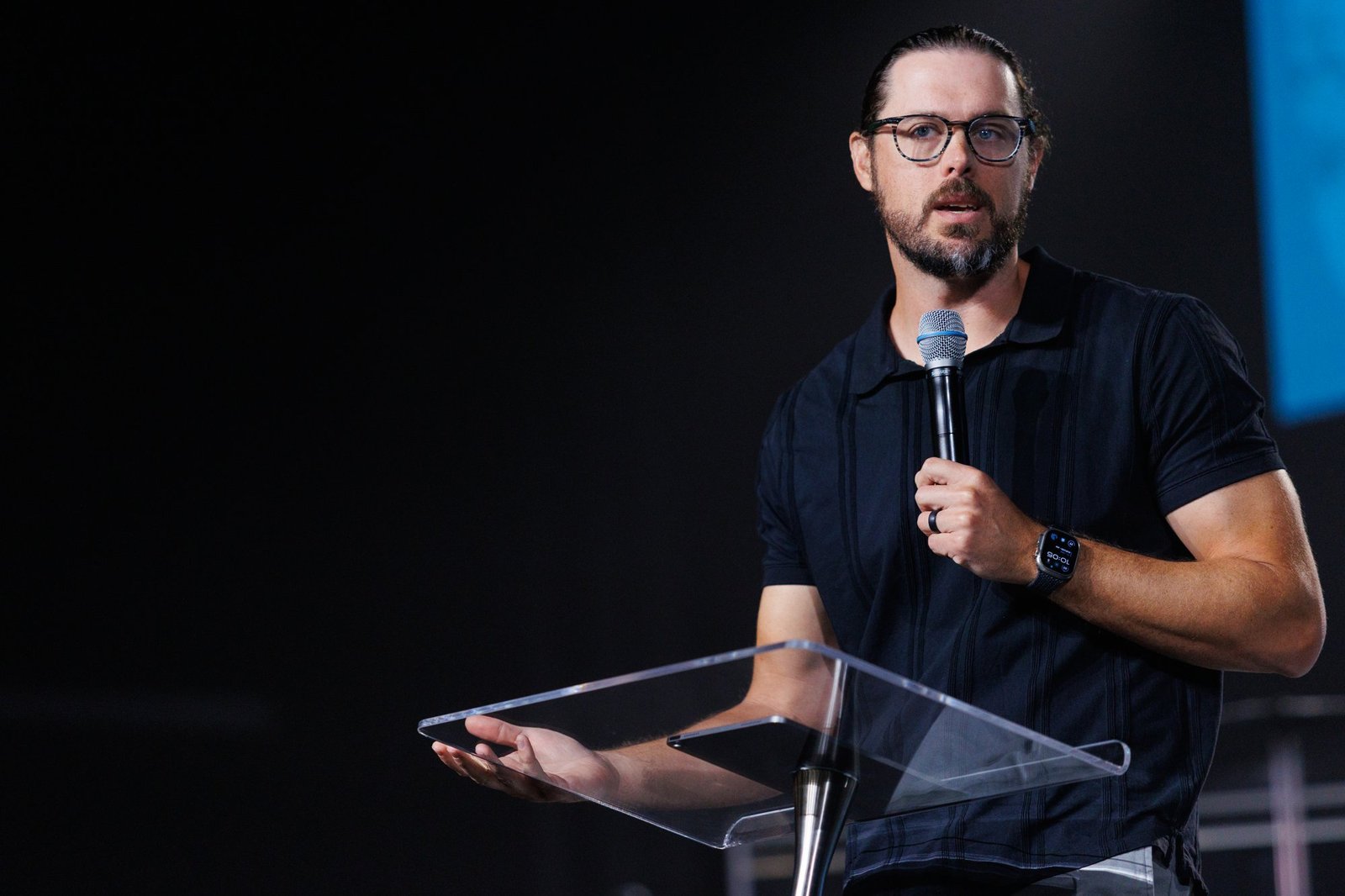A speaker addresses the congregation from a lectern