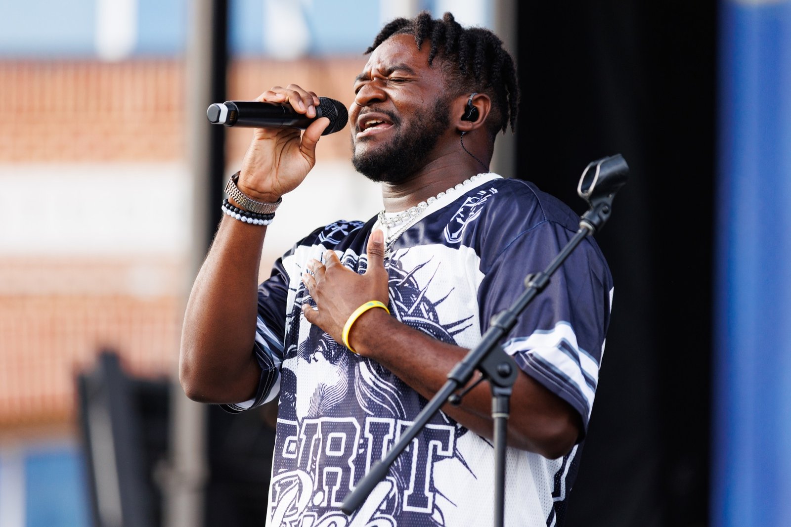 A singer performs outdoors at Block Party