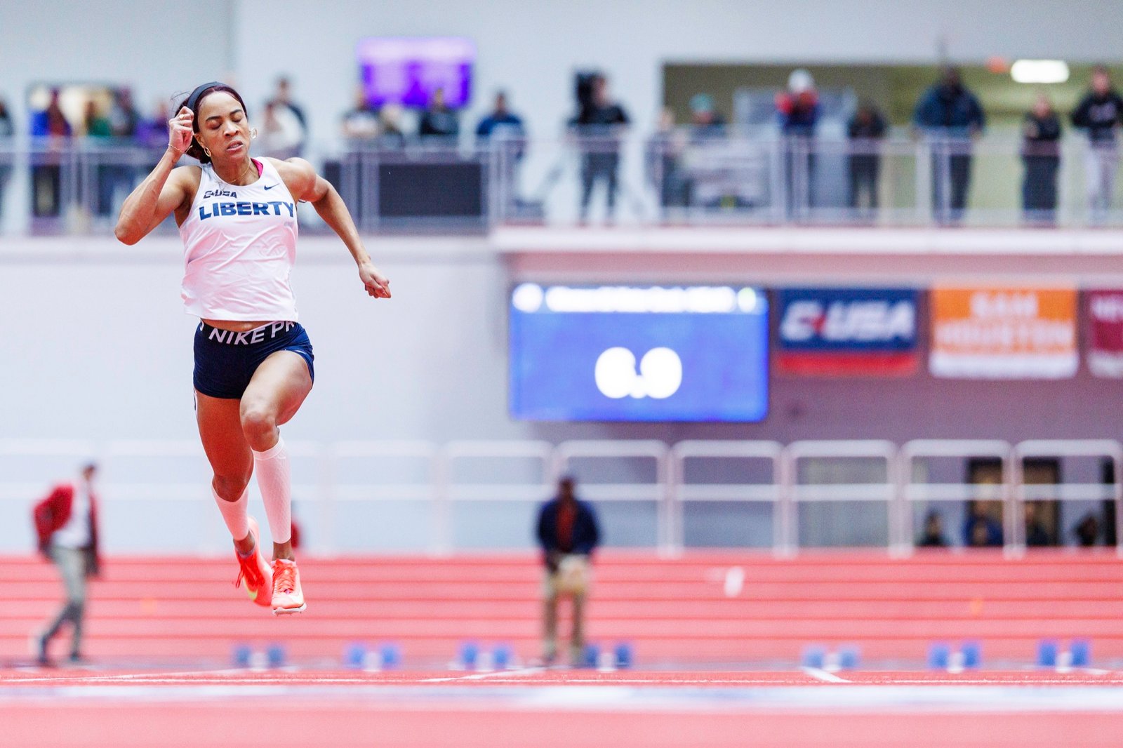A track athlete competes indoors